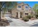 Attractive two-story home with a well-manicured front yard and attached garage in a suburban neighborhood at 5656 Fast Payout Ct, Las Vegas, NV 89122