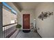 Welcoming front porch featuring a decorative wreath, 'WELCOME' sign, and potted plants, creating a warm and inviting entry at 5656 Fast Payout Ct, Las Vegas, NV 89122