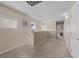 Upstairs hallway with carpet, neutral paint and natural light from a window at 5656 Fast Payout Ct, Las Vegas, NV 89122