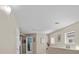 Upstairs hallway boasts neutral paint and natural light from a window at 5656 Fast Payout Ct, Las Vegas, NV 89122