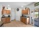 Well-lit kitchen features a tile floor, wood cabinets and granite countertops plus easy access to the backyard at 5656 Fast Payout Ct, Las Vegas, NV 89122