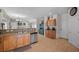 Spacious kitchen featuring stainless steel appliances, tile flooring, and an open view to the dining and living areas at 5656 Fast Payout Ct, Las Vegas, NV 89122