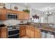 Corner kitchen featuring granite countertops, stainless steel appliances and ample cabinet space at 5656 Fast Payout Ct, Las Vegas, NV 89122