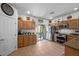 Well-equipped kitchen with stainless steel appliances and access to the backyard through sliding glass doors at 5656 Fast Payout Ct, Las Vegas, NV 89122