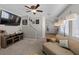 Spacious living room showcasing a comfortable sectional sofa, media console, and access to the staircase, ideal for relaxation at 5656 Fast Payout Ct, Las Vegas, NV 89122