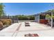 Spacious backyard with a fire pit and a covered hot tub at 5981 Doubletree Rd, Pahrump, NV 89061