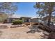 An exterior view displays a well-maintained single-story house with manicured landscaping and a desert yard at 5981 Doubletree Rd, Pahrump, NV 89061
