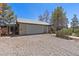 Detached garage with white door and side entrance, adjacent to an enclosed dog run for pet lovers at 5981 Doubletree Rd, Pahrump, NV 89061