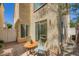 Outdoor patio area with a small table and chairs at 6125 Broken Slate Way, Las Vegas, NV 89139