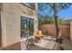 Outdoor patio area with a small table and chairs at 6125 Broken Slate Way, Las Vegas, NV 89139