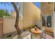 Outdoor patio area with a small table and chairs at 6125 Broken Slate Way, Las Vegas, NV 89139