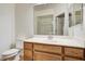 Bright bathroom featuring a vanity with a sink and a large mirror with shower at 6160 Rumrill St # 202, Las Vegas, NV 89113