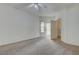 Bedroom features carpeted floors, ceiling fan, walk in closet and sliding glass door to balcony at 6160 Rumrill St # 202, Las Vegas, NV 89113