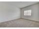 Bedroom featuring carpet floors and natural light from a window at 6160 Rumrill St # 202, Las Vegas, NV 89113
