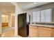 Kitchen features cabinets, laminate counters, and a view of the bathroom at 6160 Rumrill St # 202, Las Vegas, NV 89113