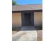 Charming front entrance featuring a secure black gate and concrete pathway at 6162 Meadow Vista Ln, Las Vegas, NV 89103