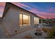 Comfortable back patio features a fountain, seating and brick pavers at 64 Lake Oasis St, Henderson, NV 89011