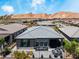 Backyard view with outdoor seating area and desert landscape, perfect for entertaining with mountain views at 64 Lake Oasis St, Henderson, NV 89011