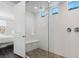 Bright bathroom with a clear glass shower and access to the main bedroom at 64 Lake Oasis St, Henderson, NV 89011