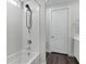 Contemporary bathroom showcases a tub, shower, and modern fixtures at 64 Lake Oasis St, Henderson, NV 89011