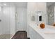 Bright bathroom featuring white quartz counters, a clear glass shower, and modern design at 64 Lake Oasis St, Henderson, NV 89011