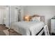 Inviting bedroom featuring a decorative bed, soft lighting, and side table at 64 Lake Oasis St, Henderson, NV 89011