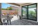 Relaxing outdoor patio area with comfortable seating and fire pit, perfect for enjoying the serene surroundings at 64 Lake Oasis St, Henderson, NV 89011