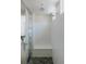 Clear glass shower with a pebbled floor, and entrance to the bedroom at 64 Lake Oasis St, Henderson, NV 89011