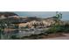 Waterfront homes offer a resort style lifestyle in a community that boasts waterfront activities and lush green landscapes at 64 Lake Oasis St, Henderson, NV 89011