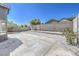 A spacious backyard with a concrete patio and gravel landscaping at 6456 First View Ave, Las Vegas, NV 89142