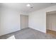 Bright bedroom with sliding closet doors and neutral carpet at 6456 First View Ave, Las Vegas, NV 89142