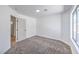 Bedroom featuring a window and entry to bathroom at 6456 First View Ave, Las Vegas, NV 89142