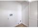 Bright laundry room with white walls, wood-look floors and hookups at 6456 First View Ave, Las Vegas, NV 89142