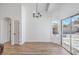 Open floor plan featuring light colored wood flooring and direct access to backyard through sliding glass doors at 6456 First View Ave, Las Vegas, NV 89142