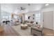 Comfortable living room showcasing modern furnishings, wood-look flooring, and easy access to the dining area at 6456 First View Ave, Las Vegas, NV 89142