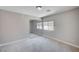Bedroom featuring mirrored closet doors and a large window at 6564 Baroque Ave, Las Vegas, NV 89139