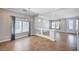Open floor plan with dining area, tile flooring, decorative lighting, and an abundance of natural light at 6564 Baroque Ave, Las Vegas, NV 89139