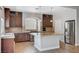 Well-lit kitchen featuring an island, stainless steel appliances, and granite countertops at 6564 Baroque Ave, Las Vegas, NV 89139