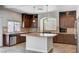 Beautiful kitchen featuring a center island, stainless steel appliances, and plenty of counter space at 6564 Baroque Ave, Las Vegas, NV 89139