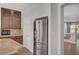 Kitchen featuring stainless steel refrigerator, microwave, and granite countertops at 6564 Baroque Ave, Las Vegas, NV 89139