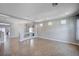 Bright and open living room with tile flooring, lots of natural light, and neutral paint colors at 6564 Baroque Ave, Las Vegas, NV 89139