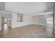 Open living room with tile flooring, recessed lighting, and a neutral color palette at 6564 Baroque Ave, Las Vegas, NV 89139