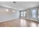 Spacious living room with tiled floors, plenty of natural light, and modern lighting at 6564 Baroque Ave, Las Vegas, NV 89139
