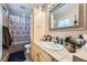 Bathroom featuring a tile floor and shower, and a vanity with ample storage at 6616 Celeste Ave, Las Vegas, NV 89107