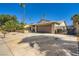 Exterior shot of house featuring desert landscaping, and an attached garage at 6616 Celeste Ave, Las Vegas, NV 89107