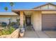 Close-up shot of house featuring potted plants and front door entrance at 6616 Celeste Ave, Las Vegas, NV 89107