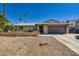 Charming single-story home featuring a two-car garage and desert landscaping at 6616 Celeste Ave, Las Vegas, NV 89107
