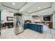 Open concept kitchen with granite counters and stainless steel refrigerator at 6616 Celeste Ave, Las Vegas, NV 89107