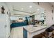Spacious kitchen with white and blue cabinets, granite countertops, and a convenient center island at 6616 Celeste Ave, Las Vegas, NV 89107