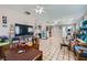 Spacious living room featuring tile floors, ceiling fan and access to backyard at 6616 Celeste Ave, Las Vegas, NV 89107